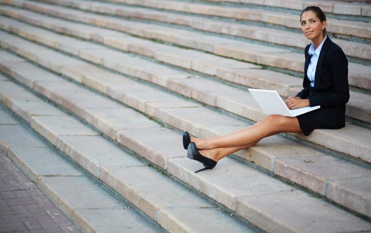 business woman sitting on stairs